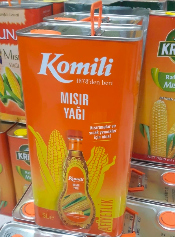 روغن ذرت برند کومیلی اصلی ، محصول وارداتی از ترکیه ، بسته بندی حلب ۵ لیتری اورجینال